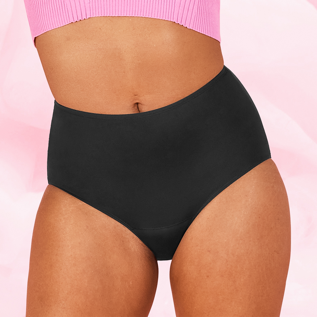 A model wearing the black high-waist style of Libresse period underwear.